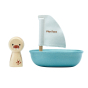 PlanToys childrens wooden walrus peg doll figure next to a blue wooden boat bath toy on a white background