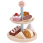 The PlanToys Bakery Stand Set, two tiers of cakes and biscuits play food. White background.