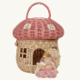Olli Ella Mushroom Rattan basket with a spotted pink mushroom cap, a door, and windows. The door is open and has a fairy outside.