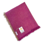 Respiin recycled wool throw blanket in the mulberry purple colour folded on a white background