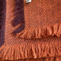 Close up of the tassels on the Respiin recycled wool throw blanket