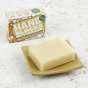 Hand Blocks Essential Oil Hand Soap Bar and Box - Sweet Orange & Bergamot on a ceramic soap dish in the foreground