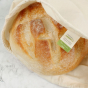 A Slice Of Green Organic Cotton Produce Bag - Extra Large, close up of label, containing a loaf of bread