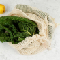 A Slice Of Green Organic Cotton Mesh Produce Bag - Extra Large containing green chard leaves