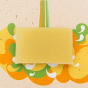 A Shower Blocks essential oil collection sweet orange and bergamot fragranced plastic free Gel Bar pictured on a orange, yellow and green coloured background 