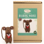 The Makerss Needle Felt Reading Mouse. A beautifully crafted little brown mouse wearing glasses and holding a tiny red book, stood next to its box
