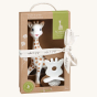 Sophie la Girafe® - So'Pure Original Teether & Natural Teether Gift Set contents in their box, decorated with a ribbon, on a cream background