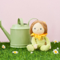 Olli Ella Dinky Dinkum Blossom Buds - Sunny Sunflower sat in the grass dotted with flowers with a green watering can behind her