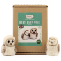 The Makerss Needle Felt Baby Barn Owl. Two beautifully crafted white and light brown baby barn owls, one with its eyes open and the other closed, stood next to their box