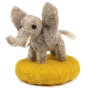 A fully made The Makerss - Amiguwoolli Tiny Elephant Mini Needle Felt Figure. The Elephant is made from grey woolen felt with white tusks, stick in eyes and a felted yellow base