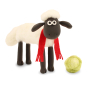 A close up of a crafted Shaun The Sheep On Four Legs Needle Felt character with a fluffy felted body, red scarf and green lettuce, on a white background