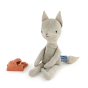 Tobe hempions toy plush fox sat on a white background with next to its orange outfit