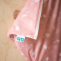Close up of the Totsbots logo on the reusable natures rainbow wet and dry nappy bag