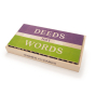Uncle Goose plastic free Women who Dared block set lined up in their box to read 'deeds not words' on the top