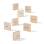 Uncle Goose kids wooden Spanish language learning blocks scattered on a white background, showing written colour names on the front