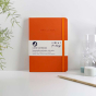 Vent for Change orange colour recycled leather lined notebook