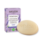 Weleda 75g solid shower body wash bar in the lavender and vetiver scent next to its cardboard box on a white background
