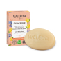 Weleda 75g solid shower body wash bar in the ylang ylang and iris scent next to its cardboard box on a white background