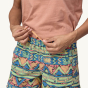 A close up of the Patagonia Women's Baggies Shorts - High Hopes Geo / Salamander Green waste tie, on a cream background