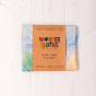 Wonderie Giant Play Cloth - A Walk Through the Seasons design folded up in a cardboard packaging sleeve