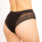 Close up of woman stood on a white background wearing the WUKA medium flow reusable lace hipster brief period pants
