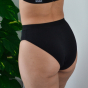 Close up of woman wearing the WUKA eco-friendly bikini brief everyday underwear on a grey background