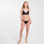 Woman stood on a white background wearing the WUKA flex detachable period bikini 
