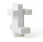 4 pieces of Naef's Quadrigo toy assembled to make a upright geometric shape.