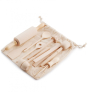 Evolving wooden mini kitchen utensil set laid on its natural cotton bag, on a white background
