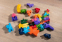 Alphabet Jigsaw sustainable multicoloured Map of America puzzle toy laid out on a wooden floor