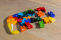 Alphabet Jigsaw handmade plastic free Elephant Alphabet wooden jigsaw in pieces laid out on a wooden floor 