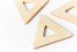 Close up of 3 triangular pieces from the Big Future eco-friendly wooden earth tiles set on a white background