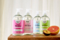 bio-D all sanitising hand washes with pumps and half a plum and half a grapefruit