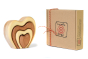 Bumbu sustainable wooden heart stacking toy on a white background next to its recyclable box