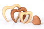 Pieces of the Bumbu eco-friendly wooden stacking heart lined up on a white background