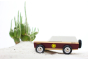 Close up of the Candylab kids wooden lone sheriff jeep on some sand in front of a cactus