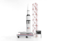 Candylab NASA astro van toy on a white background next to a miniature rocket ship