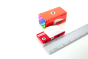 Candylab solid wooden red race car toy on a white background next to its box and a metal ruler