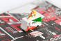 Close up of the Candylab kids toy pizza delivery truck on a red and black pizza box