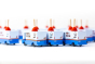 Group of children's small wooden Candylab plumbing trucks lined up on a white background