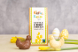 Cocoa Loco eco-friendly fairtrade milk and white chocolate chickens on a cream worktop next to some white and yellow easter eggs and daffodils