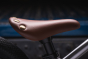 Close up of the brown seat on the Early Rider childrens charger balance bike
