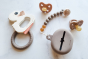 Hevea natural rubber baby pacifier and accessories spread out on a white background