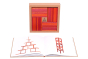 Kapla red and orange book and block set spread out on a white background, showing the instruction booklet inside