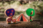 Close up of the Lanka Kade dan y ser toadstools, trees and tent on a brown forest background