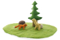 Papoose childrens fox and fawn toy figures on a green play mat next to a felt rock and tree