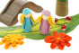 Close up of the Papoose goethe aster flowers on a white background next to some bright elf toy figures