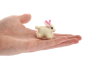 Close up of a Papoose soft felt bunny figure on the palm of a hand
