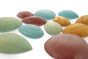 Close up of the Papoose childrens colourful earth pebble toys laid out on a white background