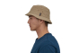 Man stood sideways on a white background wearing the Patagonia khaki eco-friendly bucket sun hat